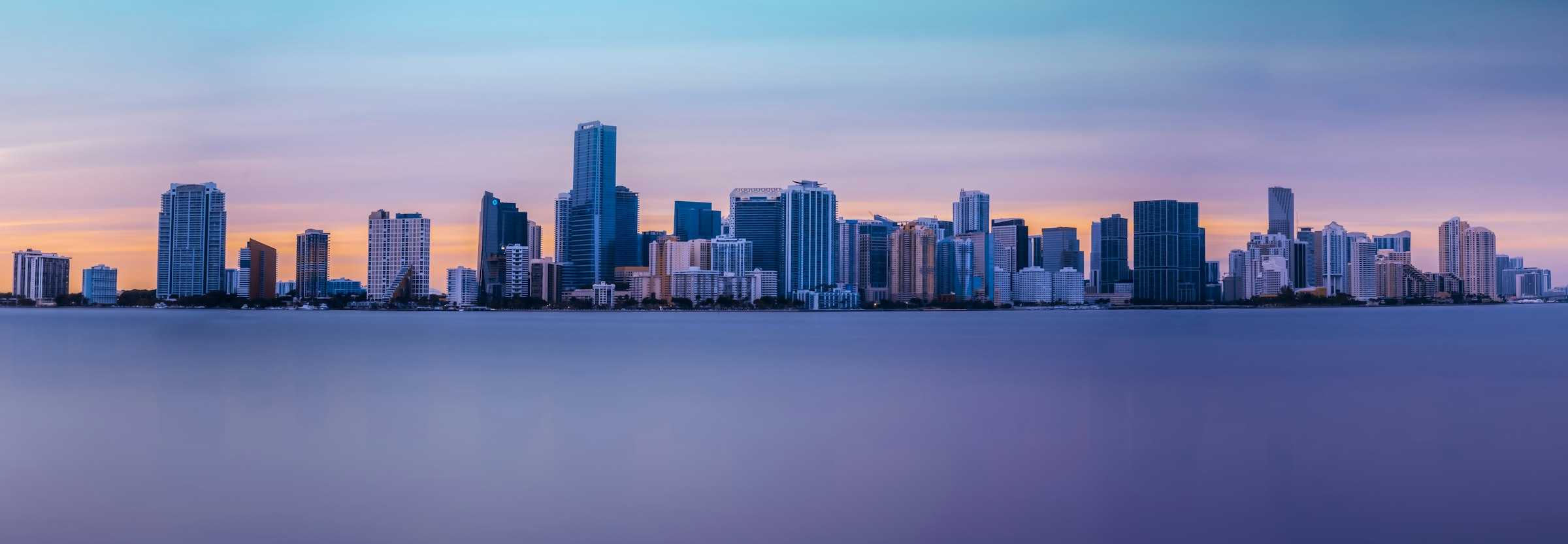 The Miami skyline across Biscayne Bay at dusk